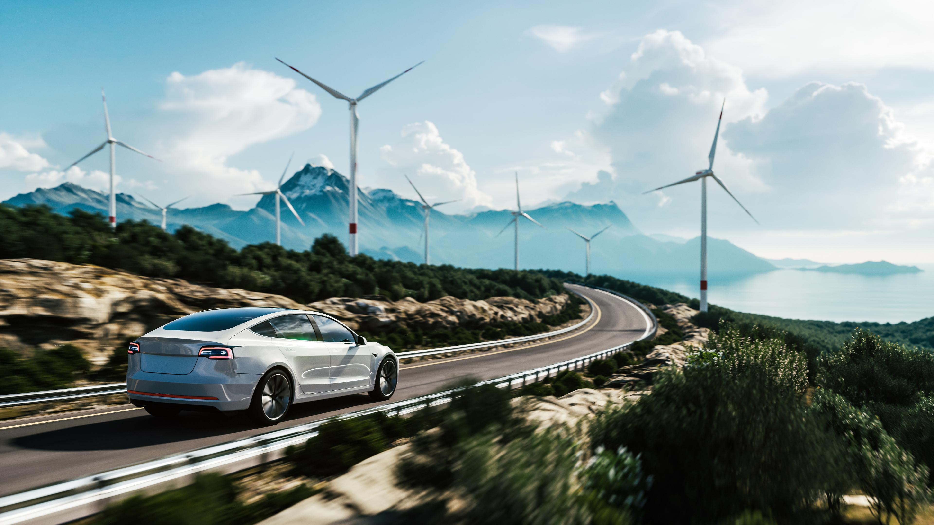 Car on road with turbines and blue sky.jpg